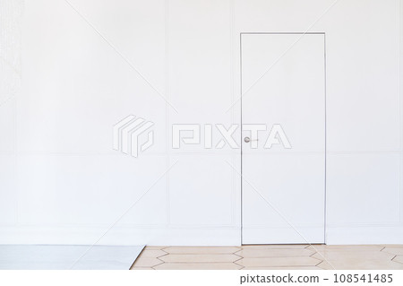 Wooden white door on a light background. Creative idea of a closed door, an entrance doorway isolated on a white background. White door design template.The concept of a closed house.High quality photo 108541485