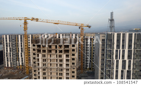 Construction of tall houses near the road. Almaty 108541547