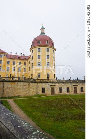 sculpture of a hunter with a dog on the balustrade of Moritzburg castle sculpture of a hunter with a dog on the balustrade of Moritzburg castle 108542092
