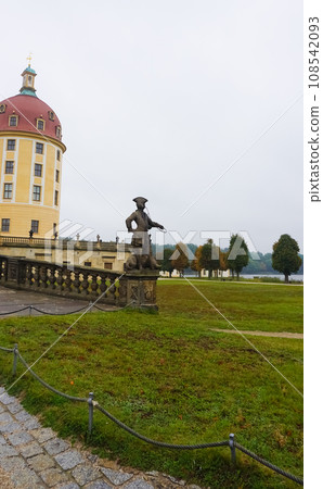 sculpture of a hunter with a dog on the balustrade of Moritzburg castle sculpture of a hunter with a dog on the balustrade of Moritzburg castle 108542093