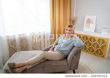 Blond senior woman relaxing 108542418