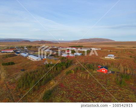 Aerial top view of houses or hotel with mountains in Iceland islands in the summer season, Europe hills, nature landscape background. 108542915