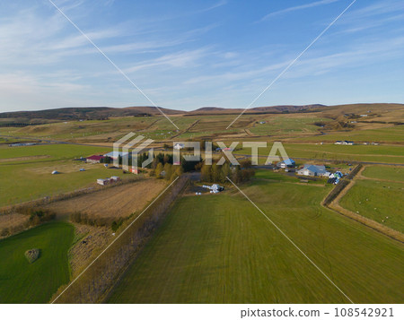 Aerial top view of houses or hotel with mountains in Iceland islands in the summer season, Europe hills, nature landscape background. 108542921