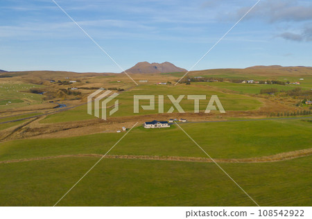 Aerial top view of houses or hotel with mountains in Iceland islands in the summer season, Europe hills, nature landscape background. 108542922