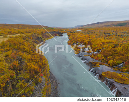 Aerial top view of Hraunfossar waterfall in autumn fall season in Iceland. Famous nature landscape background 108542956