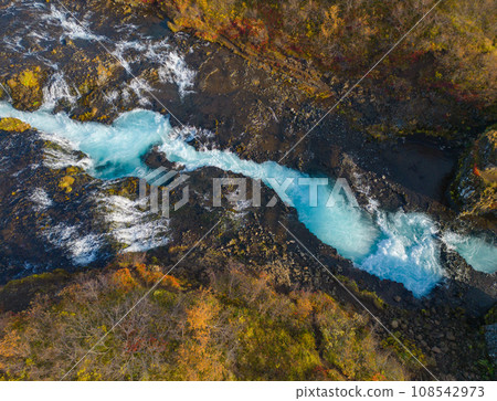 Aerial top view of Bruarfoss waterfall in autumn season in Iceland. Famous nature landscape background Aerial top view of Bruarfoss waterfall in autumn season in Iceland. Famous nature landscape background 108542973