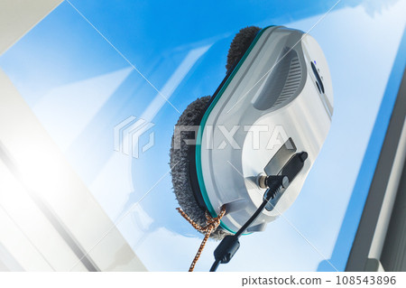 Smart vacuum cleaner washing windows. Technology concept. 108543896