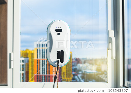 Smart vacuum cleaner washing windows. Technology concept. 108543897