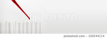 Pipette drip red liquid drops into laboratory test glass tubes. Closeup Pipette drip red liquid drops into laboratory test glass tubes. Closeup 108544114
