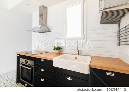 Contemporary kitchen unit with sink, stove and exhaust hood Contemporary kitchen unit with sink, stove and exhaust hood 108544440