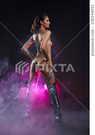 Sexy naked woman in silver boots in high heels Sexy naked woman in silver boots in high heels 108544652