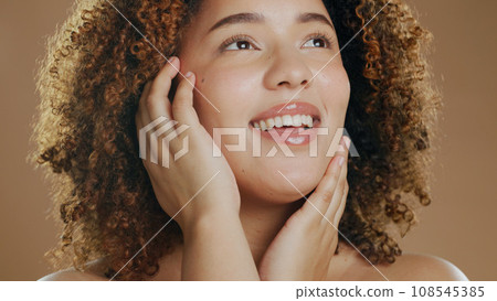 Thinking, happy model or natural beauty dermatology for cosmetics or wellness in studio with smile. Skin glow, woman or confident biracial female person with skincare results on a brown background 108545385