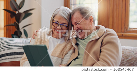 Tablet, laugh and senior couple on a sofa watching a funny, comic or comedy video on social media. Happy, smile and elderly people in retirement scroll on mobile app or internet on digital technology 108545407
