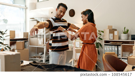Fashion, designer and tape with a man in store for measurement, planning or fabric fitting. Indian woman, tailor or employee checking a customer for small business, boutique or clothes manufacturing 108545617