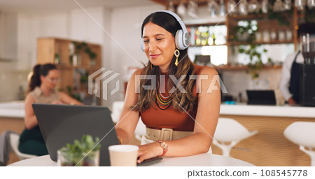 Laptop, freelance and woman in coffee shop with headphones, online research career and smile. Communication, technology and remote work, happy girl in cafe at computer, virtual assistant and internet 108545778