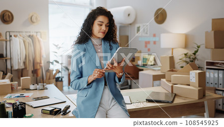 Business woman, fashion designer and tablet in logistics, research or management at boutique. Female person or entrepreneur working on technology in storage or inventory check or ecommerce app 108545925
