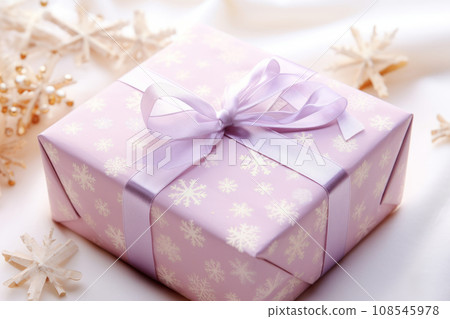 Beautifully presented snowflakes patterned gift box tied with bows in soft pastel colors. Generative AI 108545978