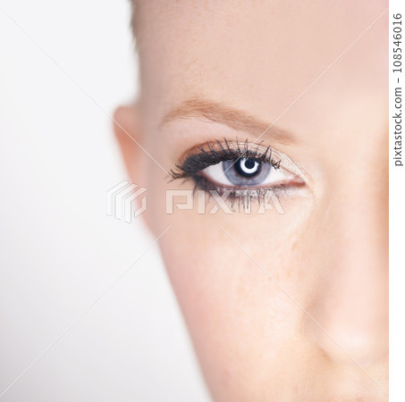 Beauty, eye and half portrait of woman with natural makeup, facial spa treatment and aesthetic dermatology in studio. Vision, skin care and face of model with light, wellness and white background. Beauty, eye and half portrait of woman with natural makeup, facial spa treatment and aesthetic dermatology in studio. Vision, skin care and face of model with light, wellness and white background. 108546016