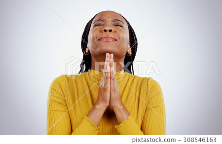 Praying, hands and black woman with stress, hope and religion with faith on white studio background. African person, girl or model with anxiety, spiritual or Christian with emoji, worship or feedback 108546163