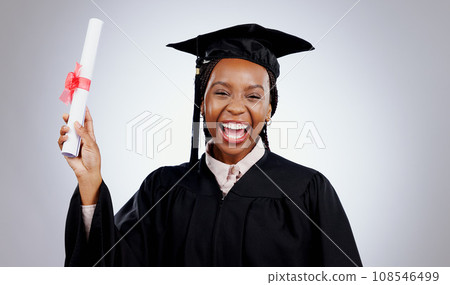 Graduation, woman and student certificate in education, college or university success on a white background. Excited portrait of african graduate with award, diploma or learning achievement in studio Graduation, woman and student certificate in education, college or university success on a white background. Excited portrait of african graduate with award, diploma or learning achievement in studio 108546499