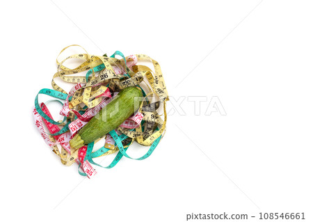 Zucchini with measuring tape on white background 108546661