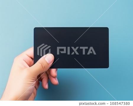Male hand holding a black bank card on a blue background AI Male hand holding a black bank card on a blue background AI 108547380