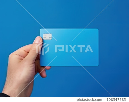 Male hand holding a blue bank card on a blue background AI Male hand holding a blue bank card on a blue background AI 108547385