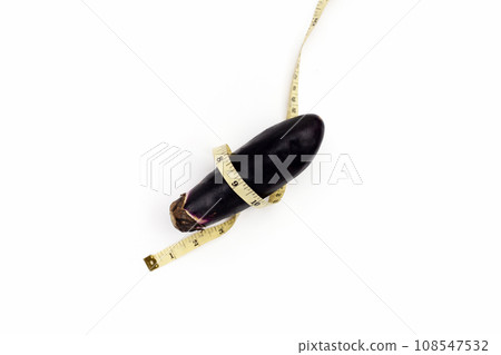 Eggplant with measuring tape on white background. 108547532