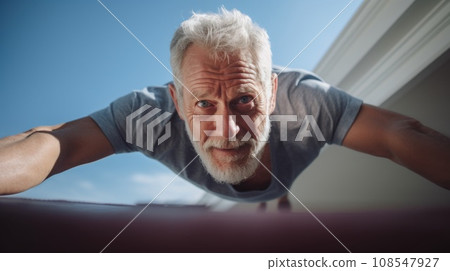 An older man doing push ups on a roof, AI 108547927