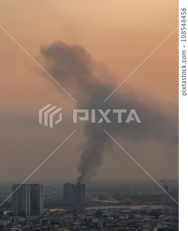 Plume of black smoke clouds from Burnt buildings on fire at some area in the bangkok city. Plume of black smoke clouds from Burnt buildings on fire at some area in the bangkok city. 108548456