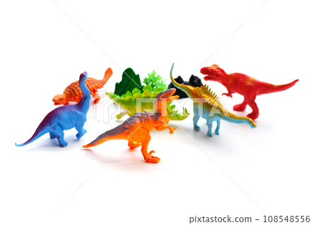 Plastic dinosaur toys on white background. Top view Plastic dinosaur toys on white background. Top view 108548556
