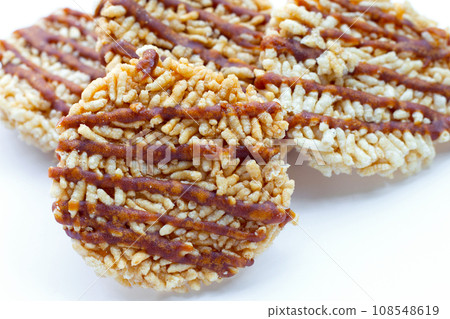 Rice cracker with coconut palm sugar on white Rice cracker with coconut palm sugar on white 108548619