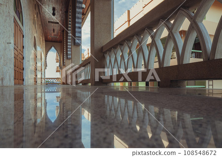 Diminishing perspective interior view of the corridor at balcony of the building beautiful mosque. Diminishing perspective interior view of the corridor at balcony of the building beautiful mosque. 108548672