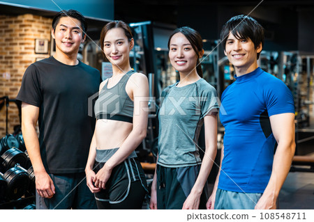 Fitness gym young men and women training Fitness gym young men and women training 108548711