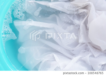 Soak a cloth before washing, white cloth 108548765