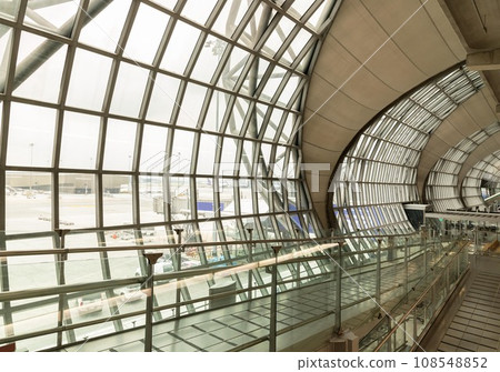 Modern architecture interior design of Metal structure and glass at Suvarnabhumi Departure Terminal. Modern architecture interior design of Metal structure and glass at Suvarnabhumi Departure Terminal. 108548852