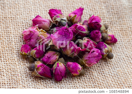 Dried roses for tea on white background. 108548894