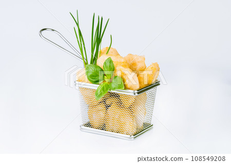 Breaded Chicken Inner Fillet on a White Background,Chicken Breaded Raw Meat.Chicken Breaded Fillet. Breaded chicken nuggets. Fast homemade food at home. Chicken breaded schnitzels. Fast cooking. 108549208