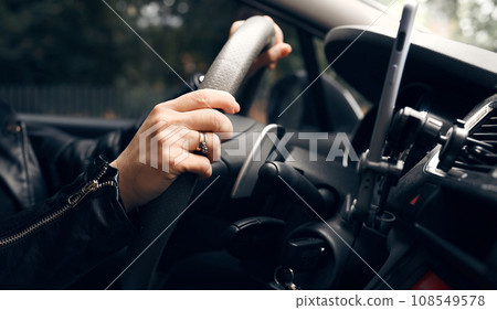 Hands On A Steer Wheel, Woman Driving City Car Hands On A Steer Wheel, Woman Driving City Car 108549578