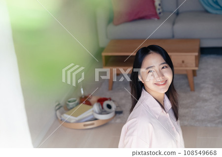 A smiling young woman who started living alone A smiling young woman who started living alone 108549668