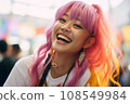 a woman with bright pink hair smiling 108549984