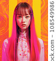 a woman with bright pink hair standing in front of a colorful background 108549986