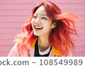 a woman with bright red hair is smiling 108549989