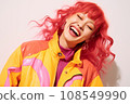 a woman with bright red hair is smiling 108549990