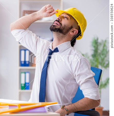 Architect working in his studio on new project Architect working in his studio on new project 108550624