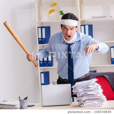 Young injured male employee working in the office 108550694