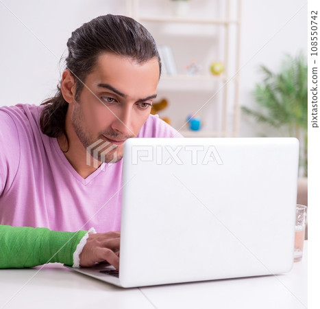 Injured young man at home Injured young man at home 108550742