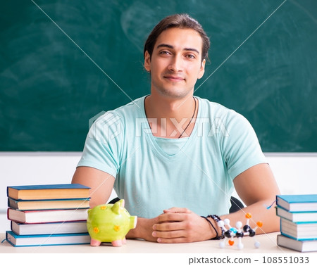 Young male student sitting in the classroom 108551033