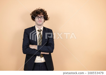 portrait young businessman wear spectacles in suit arms crossed orange background portrait young businessman wear spectacles in suit arms crossed orange background 108553479
