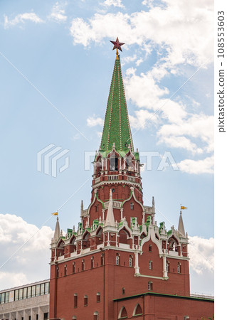 Troitskaya tower of Moscow Kremlin on a blue sky background in sunny summer day 108553603